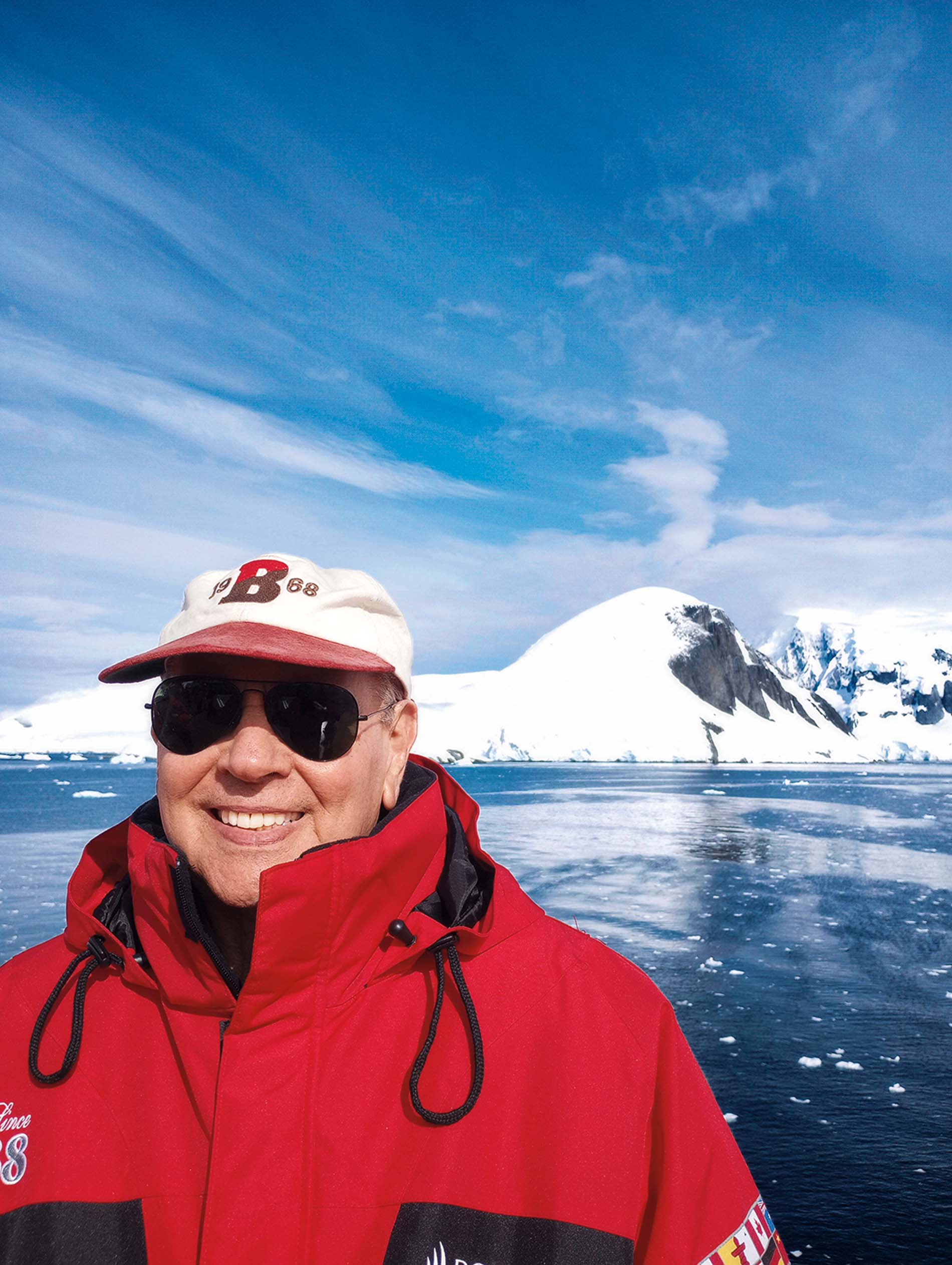 Image of Joel Bennet in front of a snow-covered mountain and icy ocean