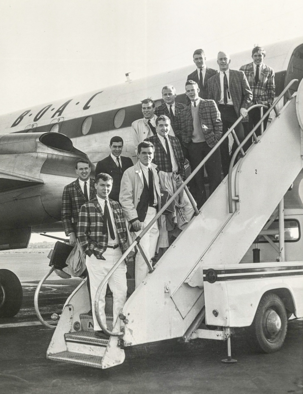 Image of 1963 Brown Jabberwocks boarding a British Overseas Airways Corporation plane.