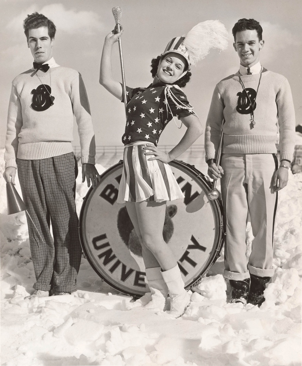 Archival image of 2 members of the Brown Band and guest majorette, Betty Brow, posing for the camera.