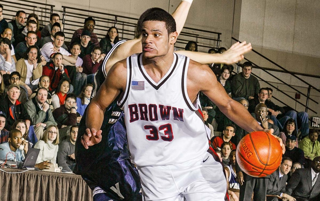 Image of Earl Hunt II dribbling the ball in a Brown basketball game