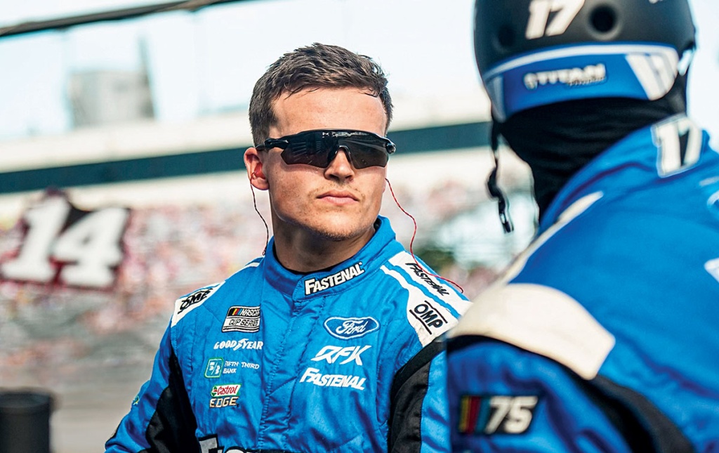 Image of Jakob Prall wearing sunglasses in a racing suit