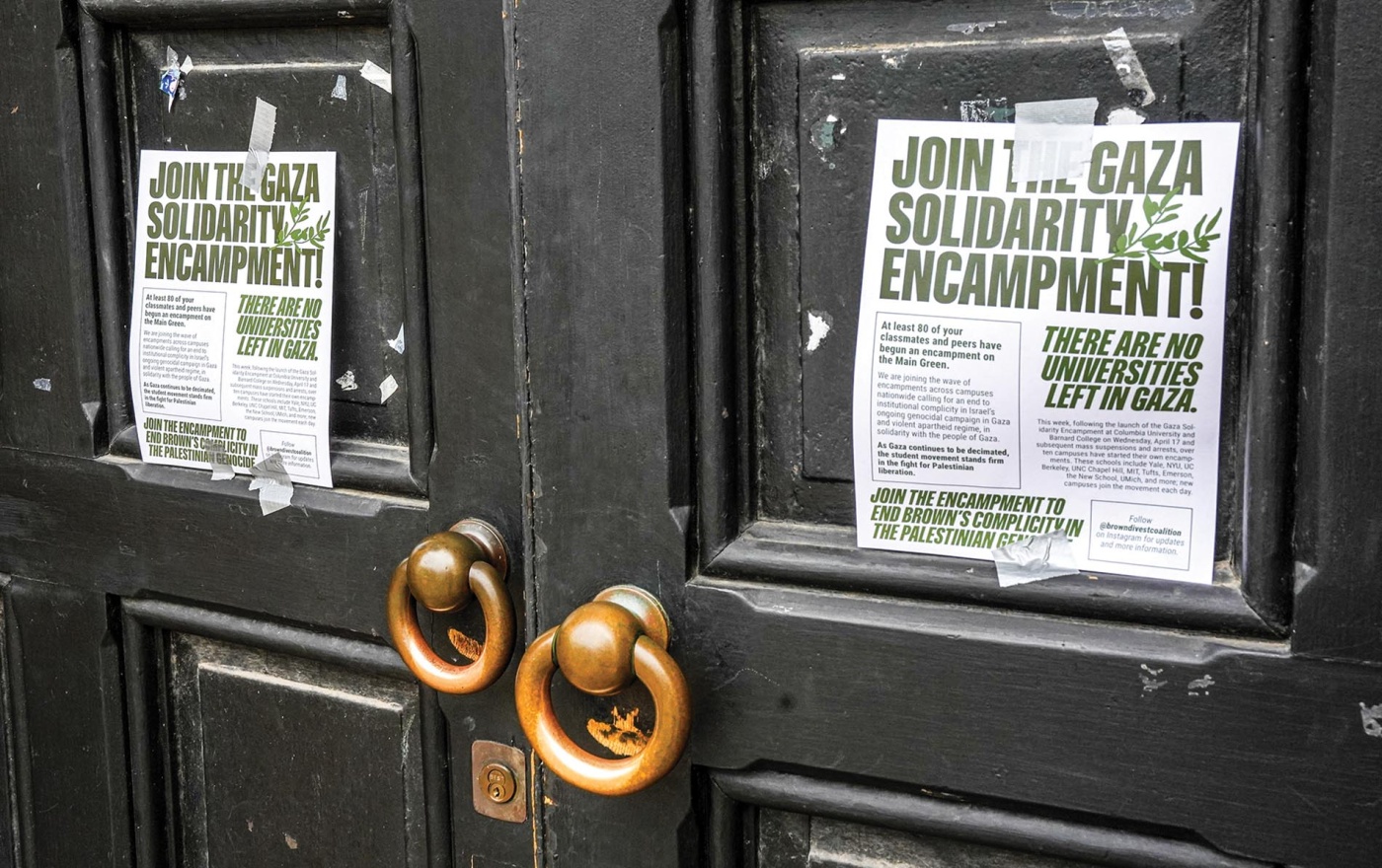 Image of doors that have signs posted declaring "Join the Gaza solidarity encampment!"