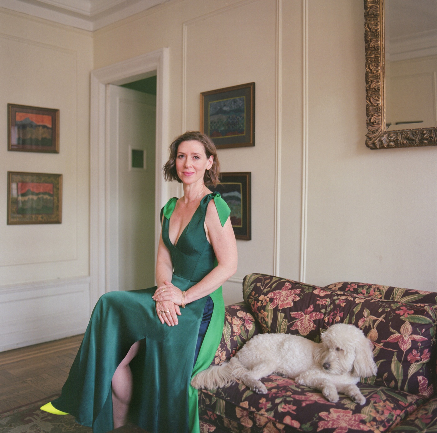 portrait of Miriam Silverman in her parents' home with the family poodle