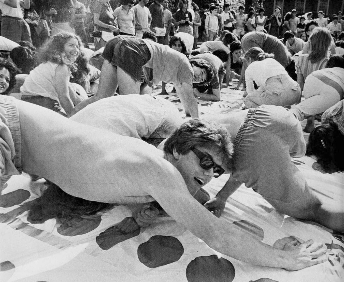 Archival image of students playing a giant Twister game on the Main Green.