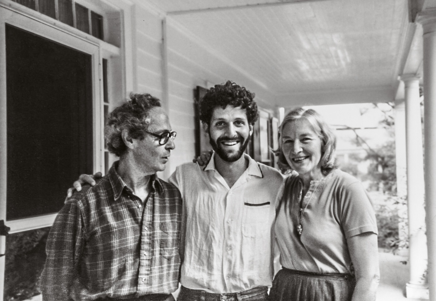 Image of George Morgan, Jeff Bercuvitz, and Barbara Morgan on a porch in 1983.