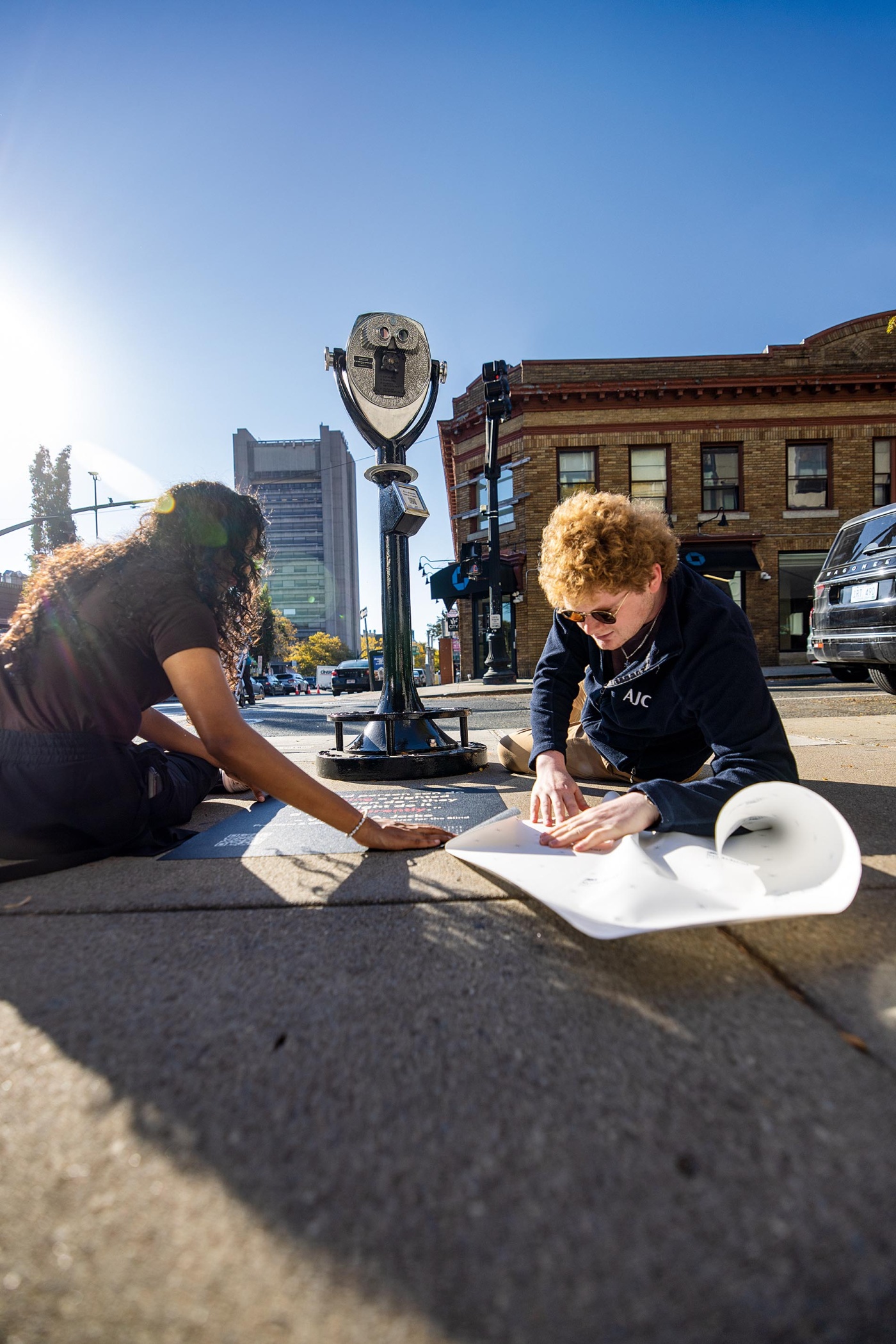 Rishika Kartik ’26 and Daniel Solomon ’26 working on The Blind Urban Subject installation at the corner of Angell and Thayer Streets.