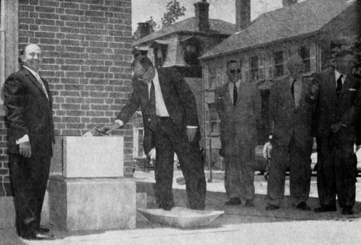 Archival image of the corner stone of Keeney Quad being placed in 1957.