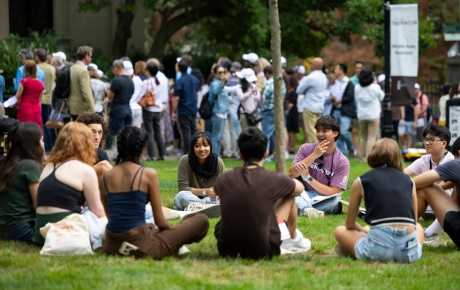 Image of students smiling on the university green